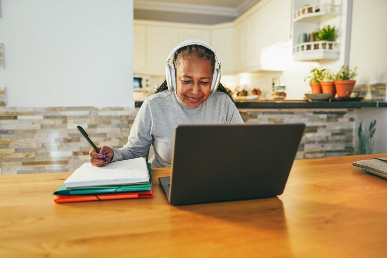 Senior woman working with laptop computer from home